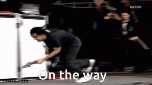Man Running With Guitar Saying On The Way GIF