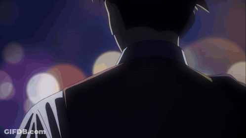 Man's Back In Dark Room With Lights GIF