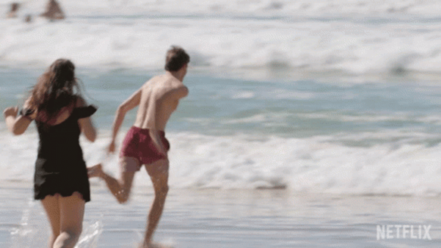 Man's Bad Fall On Funny Beach GIF