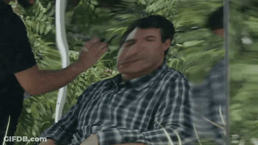 Man's Distorted Reflection On Mirror GIF