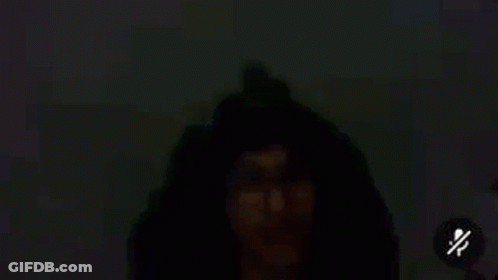 Man's Eye With Glasses In Dark GIF