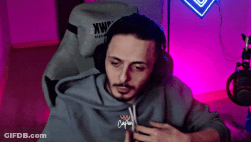 Man's Face Against Black Backdrop GIF