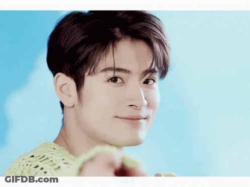 Man's Face Close Up Blue Background GIF