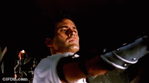 Man's Face Close Up In Dark Room GIF