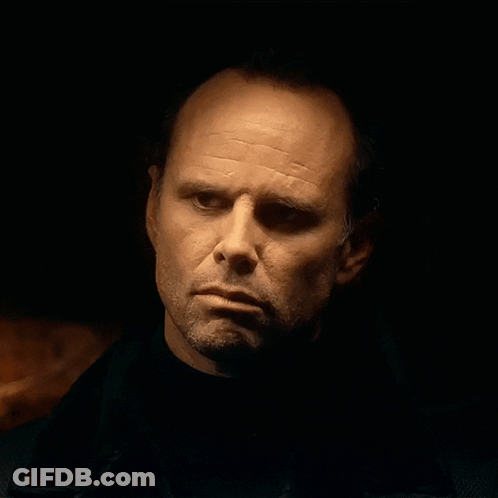 Man's Face Close Up In Dark Room GIF