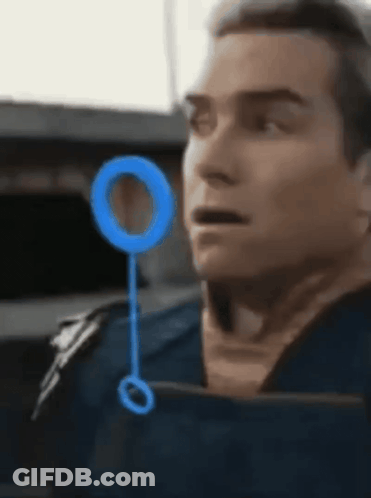 Man's Face Close Up With Blue Circle GIF