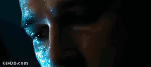 Man's Face Close Up With Blue Paint GIF