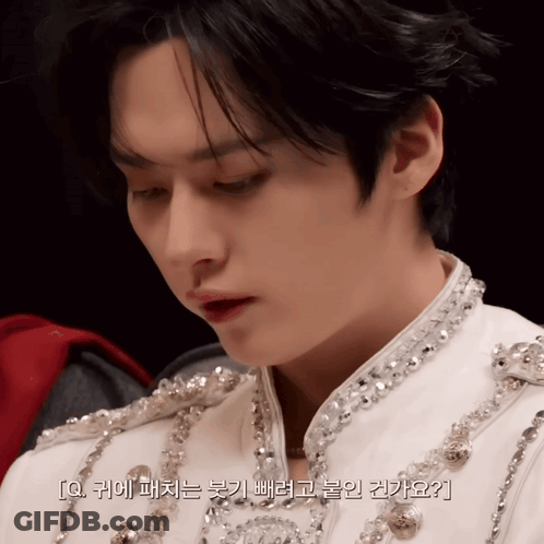 Man's Face Close Up With Korean Writing GIF