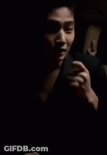 Man's Face Hand On Chest Dark Room GIF