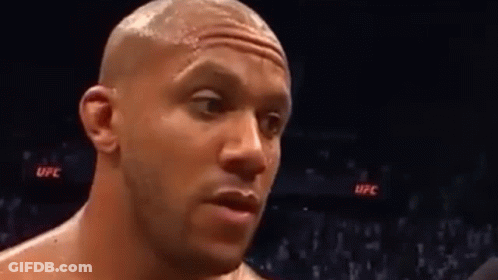 Man's Face In Boxing Ring With Crowd GIF