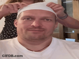 Man's Face In Dark Room GIF