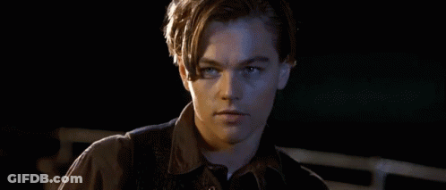 Man's Face In Dark Room Mouth Open GIF