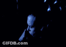 Man's Face In Dark Room With Blue Light GIF