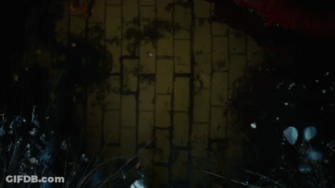 Man's Face In Dark Room With Red Lights GIF