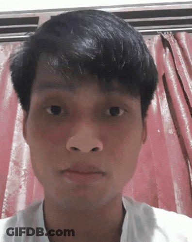 Man's Face In Front Of Pink Curtain GIF