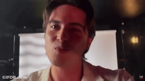 Man's Face In Front Of Screen Saying Eone GIF