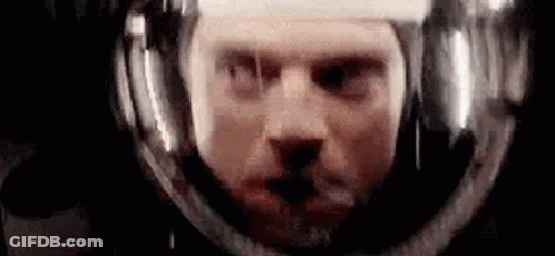 Man's Face In Space Helmet GIF