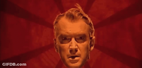 Man's Face On Purple Background With Rays GIF