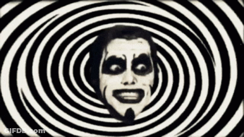 Man's Face Surrounded By Hypnotic Spirals GIF