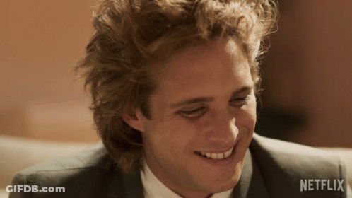 Man's Face With Netflix Logo Behind GIF