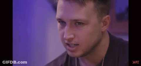 Man's Face With Purple Background And Purple Light GIF