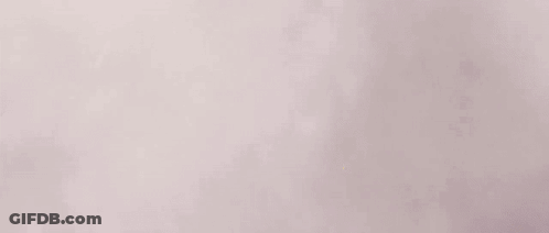 Man's Face With Purple Eyes And Teeth GIF