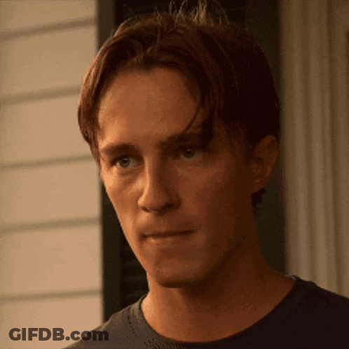 Man's Face With Slight Smile GIF