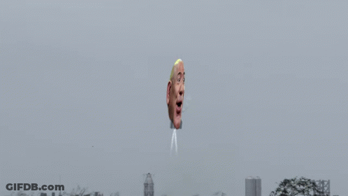 Man's Head Coming Out Of Air In Front Of City GIF