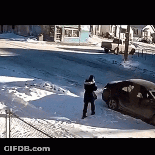 Man's Winter Struggle Of Slipping On Ice GIF