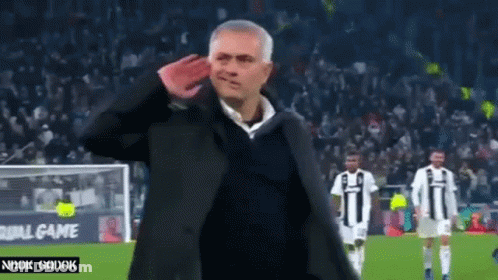 Man Saluting On Soccer Field With Players GIF