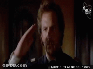 Man Saluting Sitting In Chair GIF