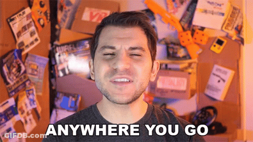 Man Saying Anywhere You Go By Wall Of Items GIF