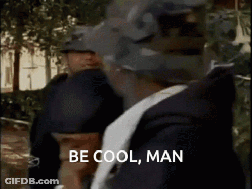 Man Saying Be Cool Man In Front Of Two Police Officers GIF