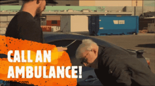 Man Saying Call An Ambulance To Older Man GIF