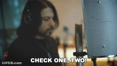 Man Saying Check One Two Into Microphone GIF