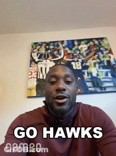 Man Saying Go Hawks In Front Of Football Painting GIF