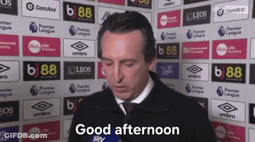 Man Saying Good Afternoon In Front Of Advertisement Wall GIF