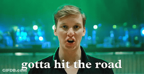 Man Saying Gotta Hit The Road In Front Of Green Lights GIF