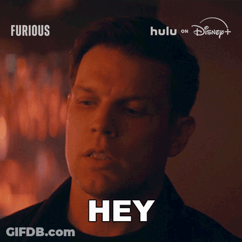 Man Saying Hey In Front Of Disney Logo GIF