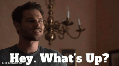 Man Saying Hey What's Up By Candle Chandelier GIF