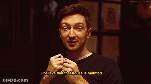 Man Saying I Believe That House Is Haunted In Dark Room GIF