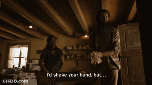 Man Saying I'd Shake Your Hand But In Kitchen With Woman GIF