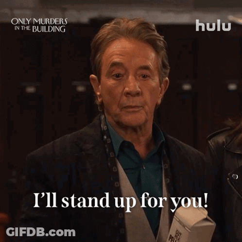 Man Saying I'll Stand Up For You Holding Carton GIF