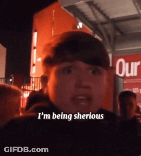 Man Saying I'm Being Sherious By Red Sign GIF