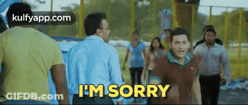 Man Saying I'm Sorry While Walking In Front Of Crowd GIF