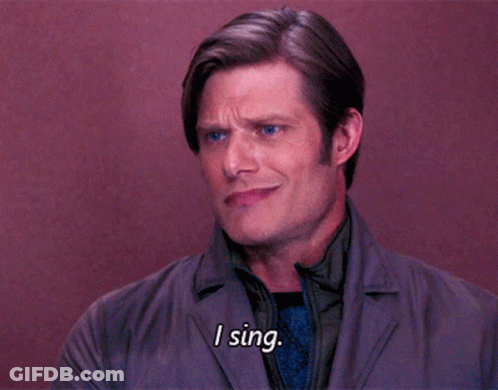 Man Saying I Sing While Wearing Jacket And Tie GIF