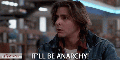 Man Saying It'll Be Anarchy In Front Of Breakfast Club Sign GIF