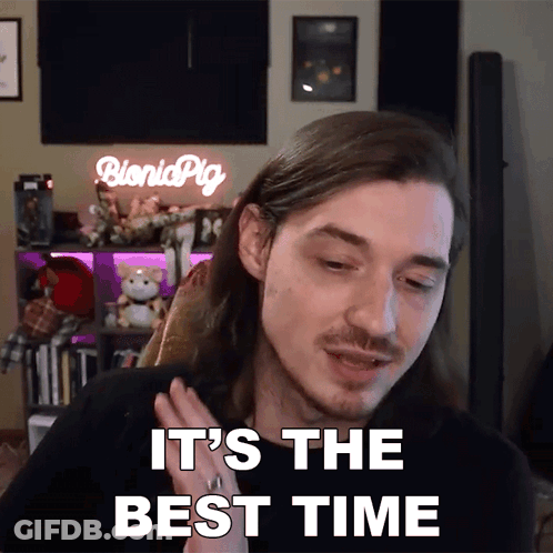 Man Saying It's The Best Time In Front Of Bionic Pig Sign GIF