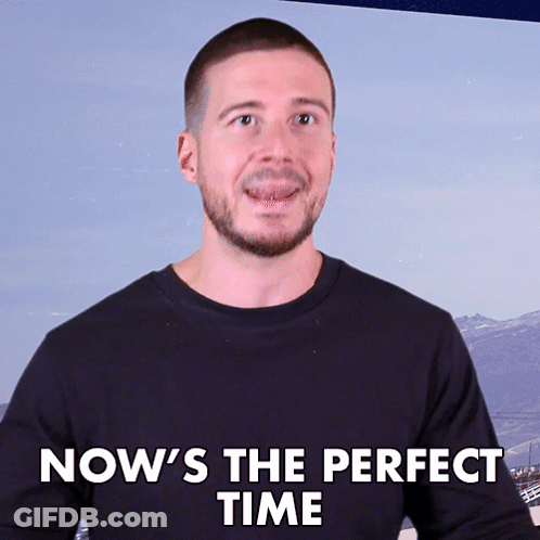 Man Saying Now's The Perfect Time With Mountain Background GIF