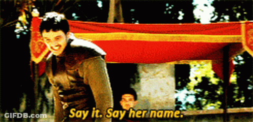 Man Saying Say It Say Her Name In Front Of Banner GIF